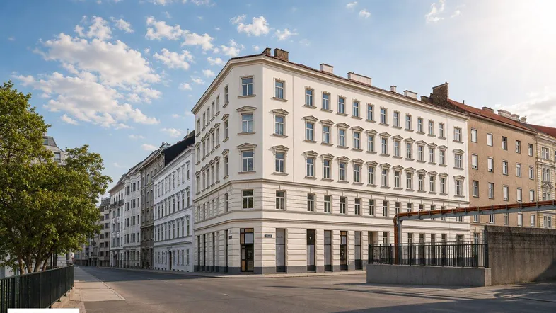 Elegantes Eckgebäude in urbaner Umgebung mit klassischer Architektur und vielen Fenstern.