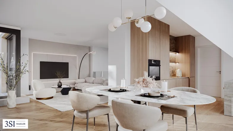 Modernes, offenes Wohn- und Esszimmer mit integrierter Küche und Holzboden.