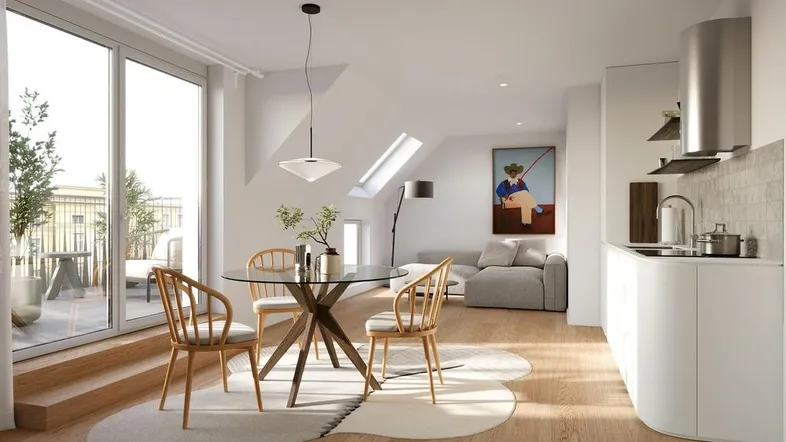 Heller, offener Wohn- und Essbereich mit integrierter Küche, Holzboden und Zugang zur Terrasse.