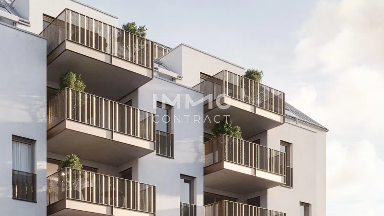 Moderne Wohngebäude-Fassade mit zahlreichen Balkonen und zeitgenössischer Architektur.
