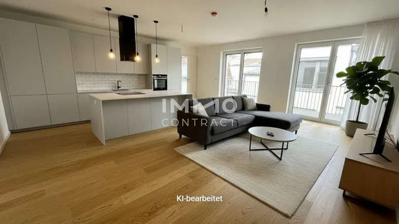 Moderne offene Küche mit Wohnbereich, Holzboden und Zugang zum Balkon, ideal für geselliges Beisammensein.