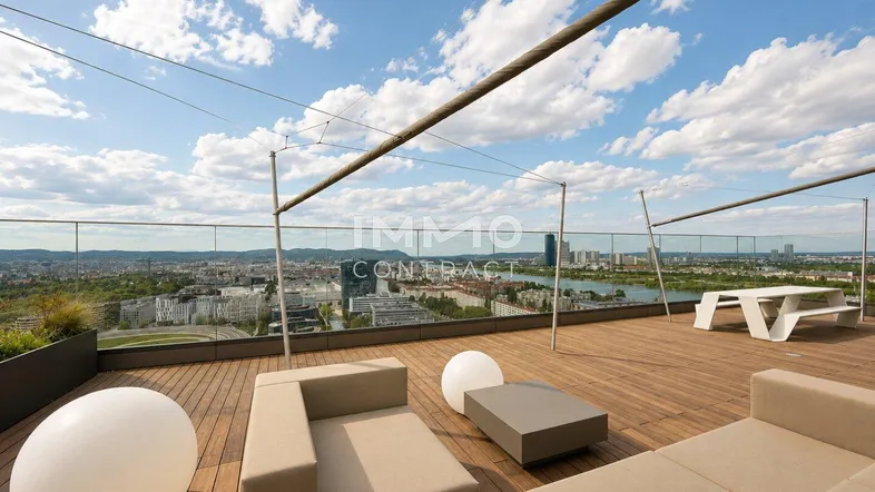 Große Dachterrasse mit modernen Loungemöbeln und weitem Blick über die Stadt und den See.