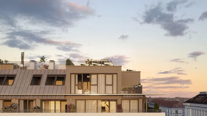 Moderne Dachterrasse mit Sitzgelegenheiten und weitem Blick über die Stadt bei Sonnenuntergang.