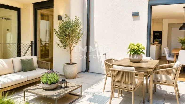 Gemütliche Terrasse mit modernen Gartenmöbeln, Pflanzen und direktem Zugang zum Innenbereich.