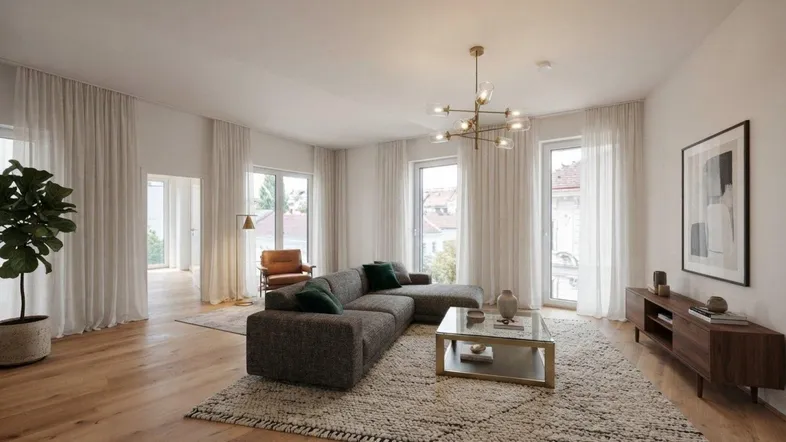 Helles, modern eingerichtetes Wohnzimmer mit großem Sofa, Holzboden und Zugang zu mehreren Fenstern.