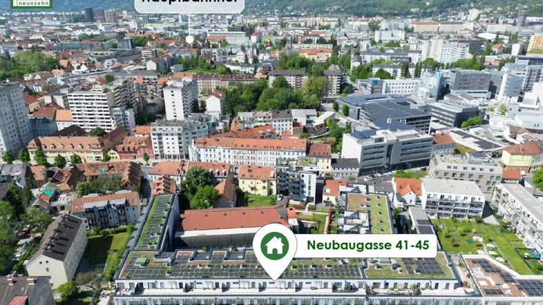 Luftaufnahme der Stadt mit markiertem Neubau und Hauptbahnhof in der Nähe.