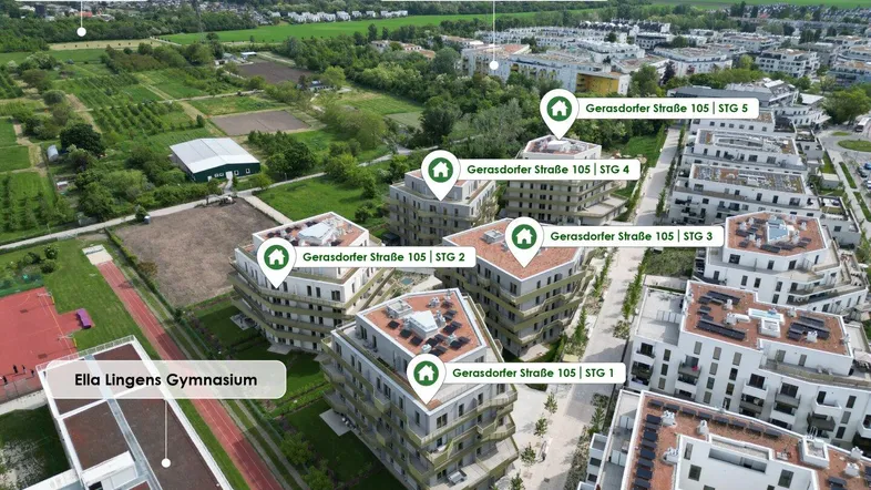 Luftaufnahme der Wohnanlage mit umliegenden Grünflächen und Infrastruktur.