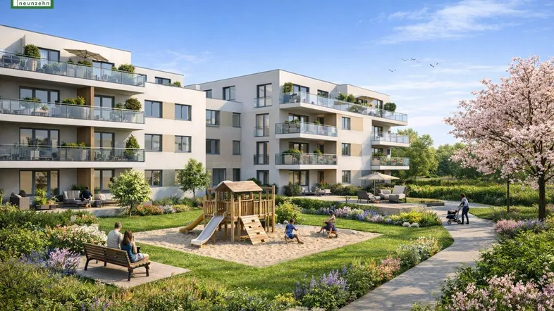 Moderne Wohnanlage mit gepflegtem Gemeinschaftsgarten, Spielplatz und blühenden Bäumen unter blauem Himmel.