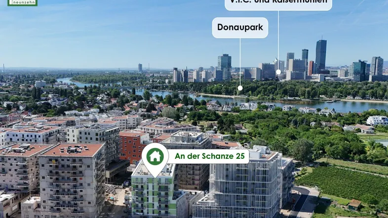 Luftaufnahme des Neubauprojekts 'An der Schanze 25' mit Blick auf die Donau und die Wiener Skyline.
