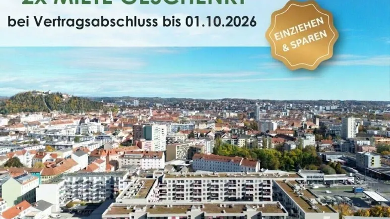 Luftaufnahme einer Stadt mit Wohngebäuden und Hügeln im Hintergrund, überlagert von einer Werbebotschaft.