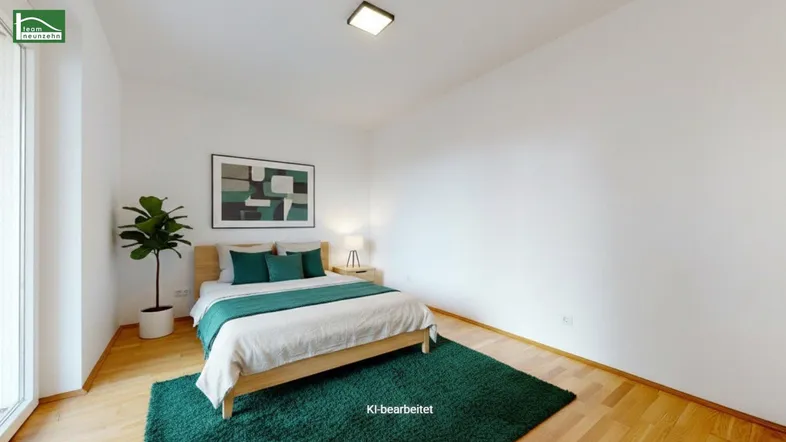 Modernes Schlafzimmer mit Holzboden, weiß gestrichenen Wänden und einem grünen Teppich.