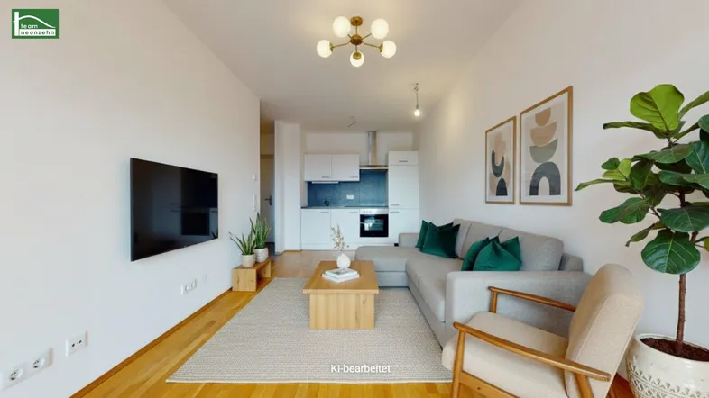 Modernes Wohnzimmer mit offener Küchenzeile, Holzboden und stilvoller Einrichtung.