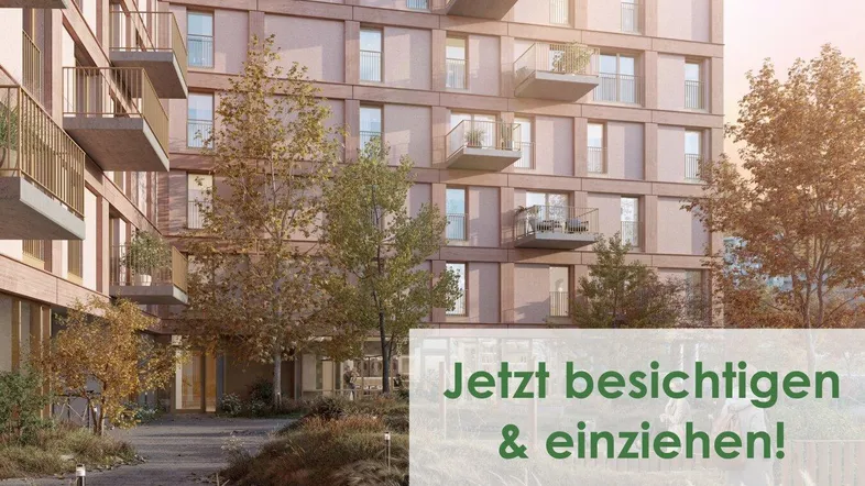 Modernes Apartmentgebäude mit zahlreichen Balkonen und ansprechend gestalteten Grünflächen im Vordergrund.