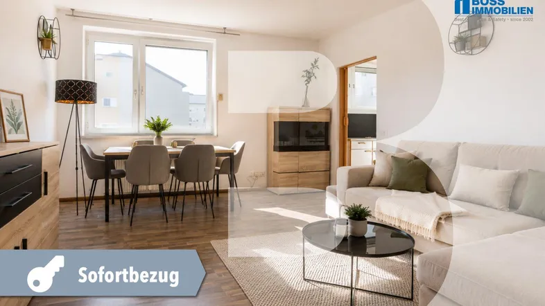 Helles Wohn- und Esszimmer mit modernem Sofa, Esstisch und Holzboden.