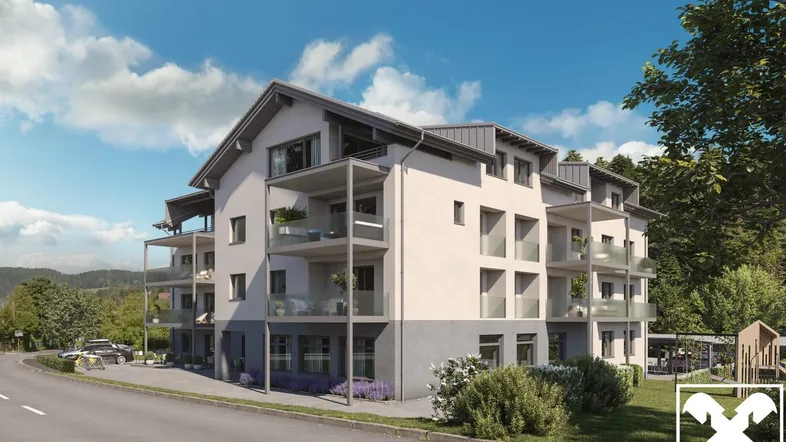 Moderne Wohnanlage mit Balkonen und Bergblick in grüner Umgebung, umgeben von Natur.