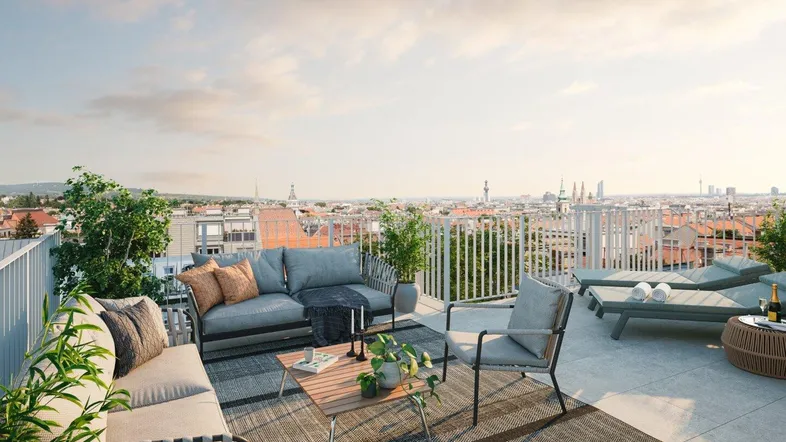 Große Dachterrasse mit bequemen Loungemöbeln und weitem Blick über die Stadt.