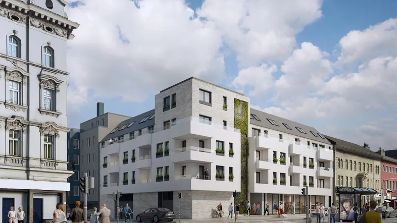 Moderne Wohnanlage mit weißer Fassade, Balkonen und vertikalen Grünflächen in urbaner Umgebung.