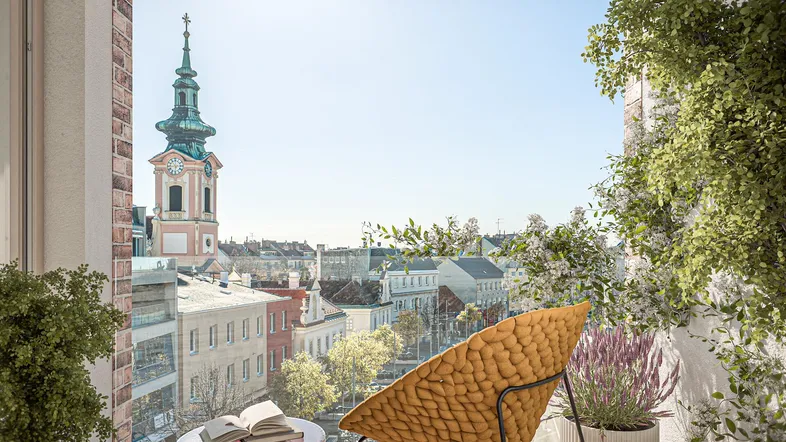 Heller Balkon mit moderner Sitzgelegenheit und weitem Blick über die Stadt.