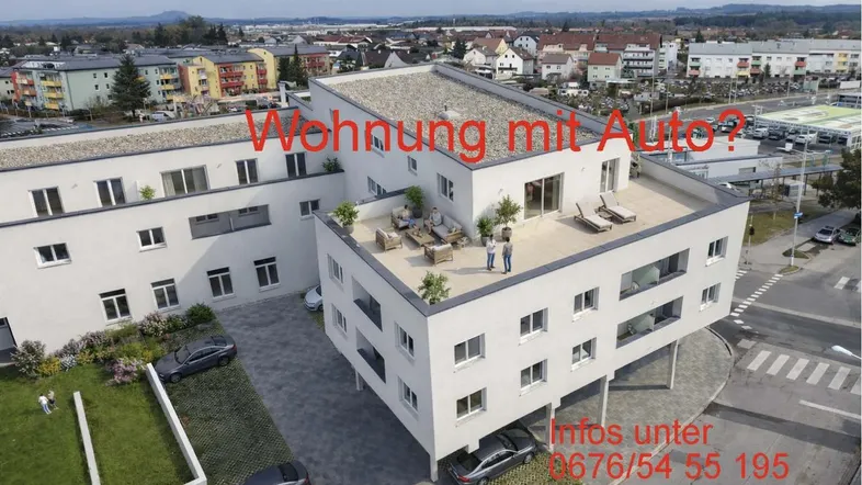Moderne Wohnanlage mit großer möblierter Dachterrasse und Blick auf die umliegende Stadt.