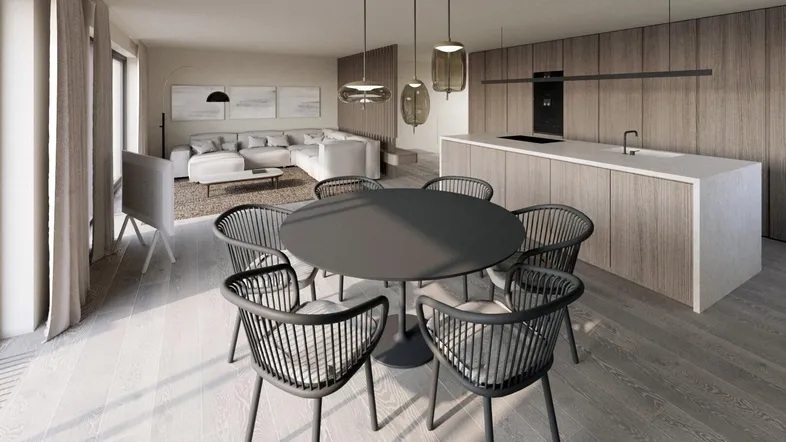 Modernes, offenes Wohn- und Esszimmer mit integrierter Küche und Holzboden.
