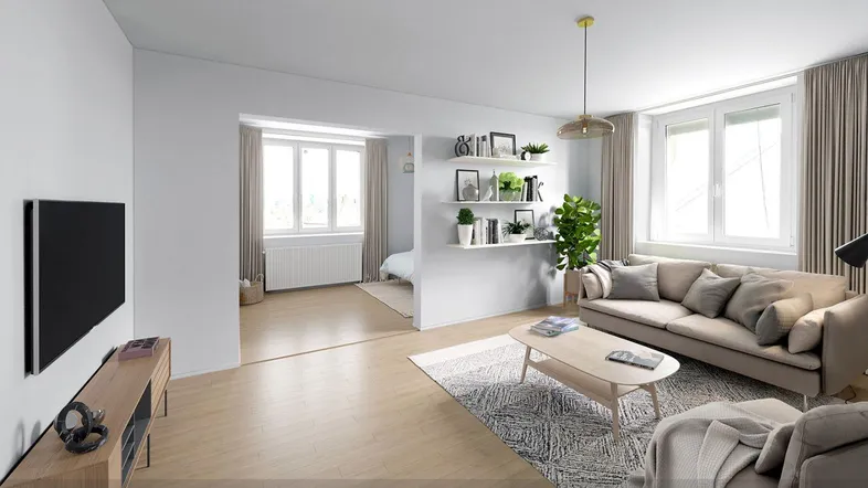 Modernes, helles Wohnzimmer mit Holzboden und offenem Übergang zu einem Schlafbereich.