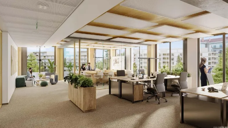 Helles, offenes Büro mit modernen Arbeitsplätzen, großen Fenstern und integrierten Pflanzen für angenehme Atmosphäre.
