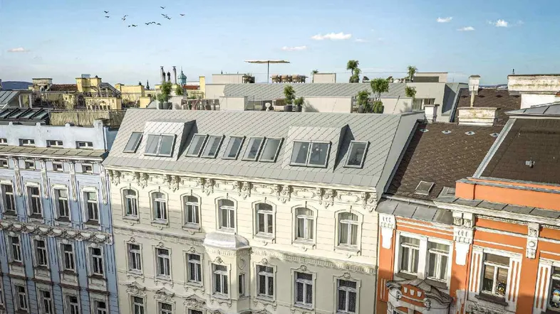 Blick auf die Dächer der Stadt mit einer modernen Dachterrasse und umliegenden Gebäuden.