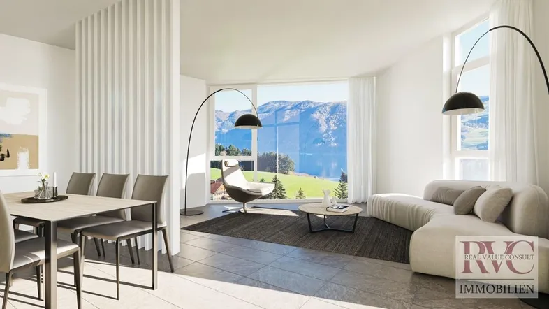 Heller Wohn- und Essbereich mit großen Fenstern, Seeblick und modernen Möbeln.