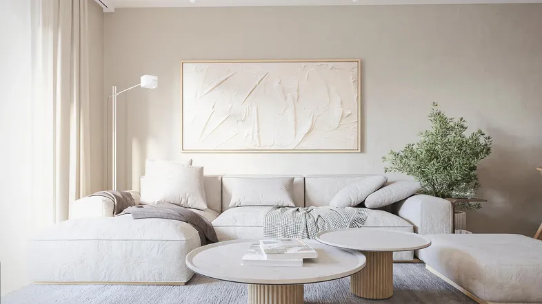 Helles und modernes Wohnzimmer mit beigem Sofa, Couchtischen und minimalistischer Dekoration.