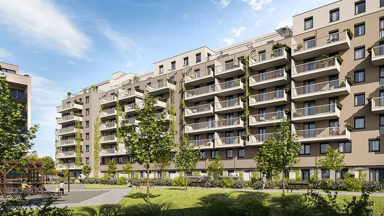 Moderne Wohnanlage mit zahlreichen Balkonen und einem begrünten Innenhof.