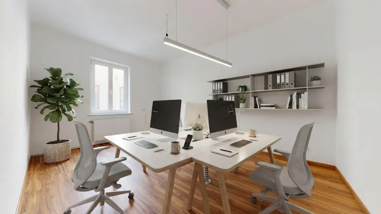 Modernes Büro mit zwei Arbeitsplätzen, hellen Wänden und Holzfußboden, ideal für produktives Arbeiten.