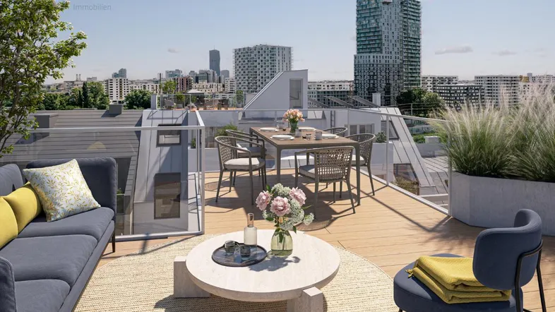 Geräumige Dachterrasse mit modernen Möbeln und weitem Blick über die Stadt.