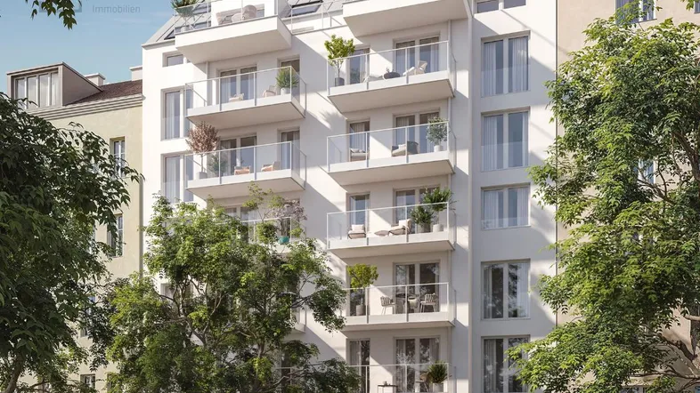 Modernes Wohngebäude mit mehreren Balkonen und großen Fenstern in städtischer Umgebung.