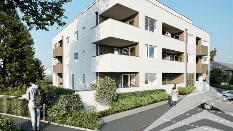 Moderne Wohnanlage mit weißer Fassade, Balkonen und gepflegter Außenanlage in städtischer Umgebung.