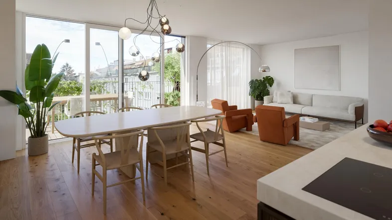 Heller, offener Wohn- und Essbereich mit Holzboden, modernen Möbeln und Zugang zu einem Balkon.
