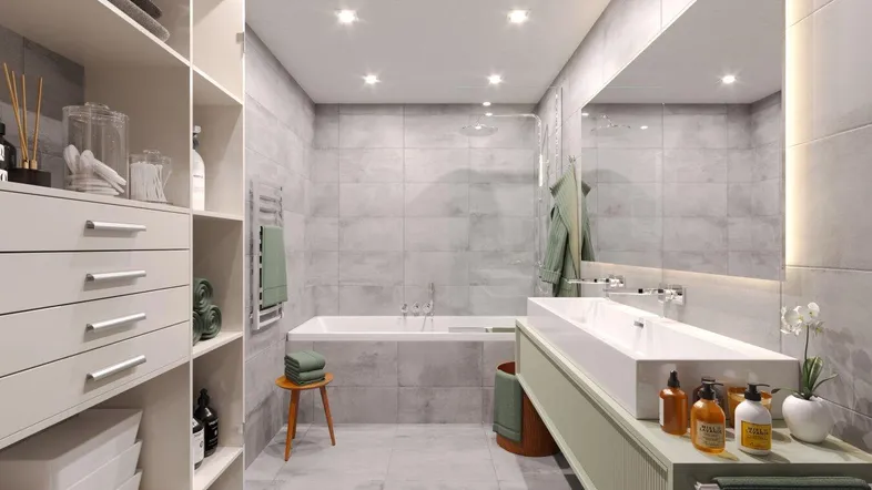 Modernes Badezimmer mit grauen Fliesen, Badewanne, Doppelwaschbecken und integrierten Regalen.