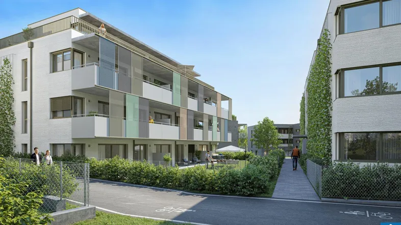 Moderne Wohnanlage mit mehreren Gebäuden, Balkonen, Terrassen und begrünten Außenbereichen.