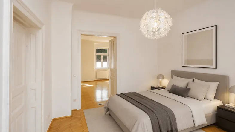 Helles Schlafzimmer mit Parkettboden, modernem Bett und Zugang zu einem weiteren Raum.