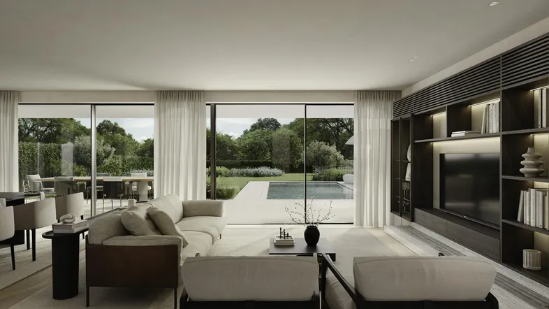 Helles, modernes Wohn-Esszimmer mit großen Fensterfronten, die einen Blick auf den Garten und Pool bieten.
