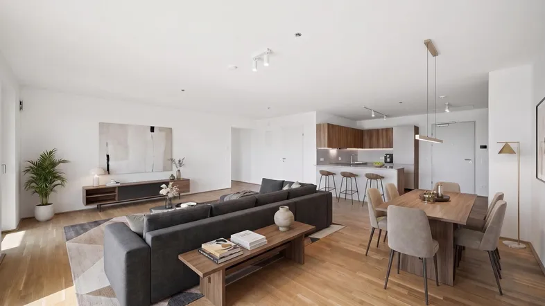 Helles, modern eingerichtetes Wohnzimmer mit offener Küche, Essbereich und Holzboden.