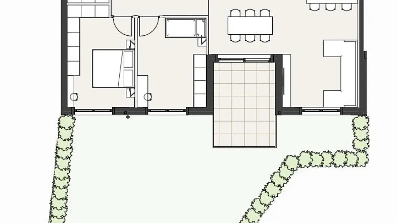 Grundrissplan eines Hauses mit zwei Schlafzimmern, einem Badezimmer und einem großen Gartenbereich.