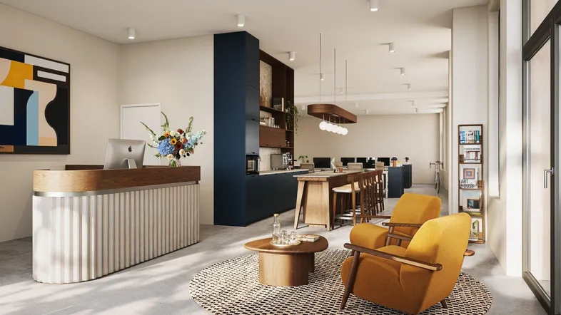 Moderne Büroräume mit Empfangsbereich, Lounge-Sitzgelegenheiten und offener Teeküche, hell und einladend gestaltet.