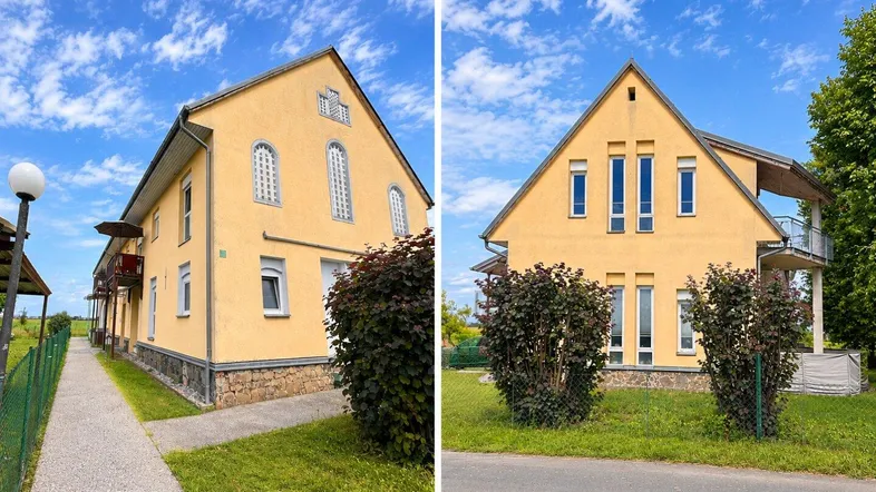 Gelbes Mehrfamilienhaus mit Satteldach und gepflegter Fassade unter blauem Himmel.