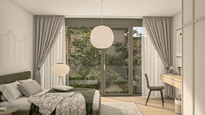 Modernes Schlafzimmer mit großem Bett, Schreibtisch und Zugang zu einem grünen Außenbereich.
