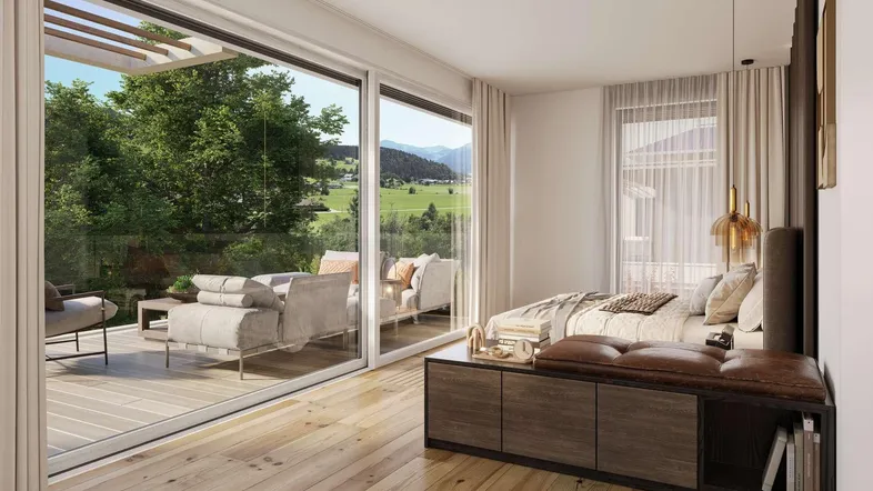 Helles Schlafzimmer mit Holzboden, großen Fenstern und Zugang zu einer Terrasse mit Bergblick.