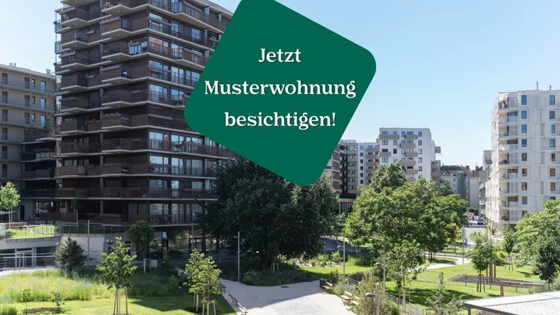 Moderne Wohnanlage mit mehreren Gebäuden und großzügigen Grünflächen im Freien.