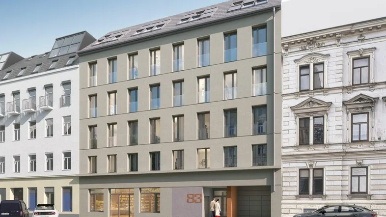 Moderne Gebäudefassade eines Neubaus mit großen Fenstern und Dachgauben in städtischer Umgebung.