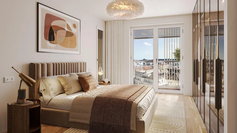 Helles Schlafzimmer mit modernem Bett, Einbauschrank und Zugang zu einem Balkon mit Stadtblick.