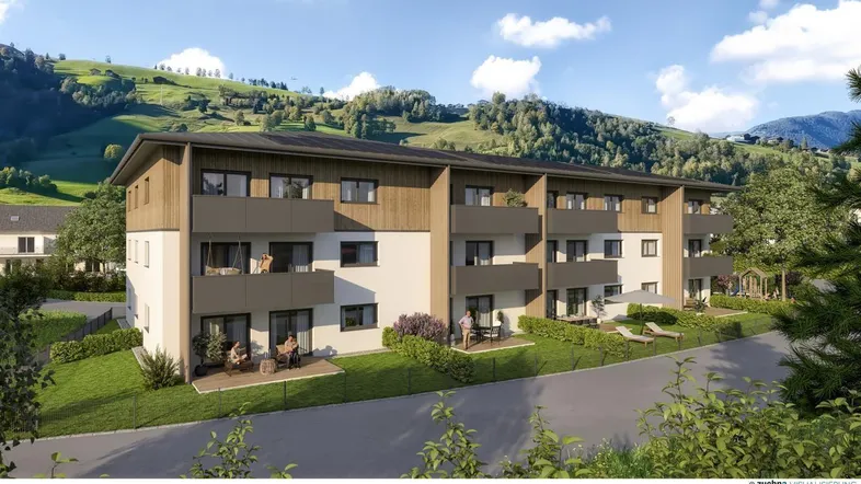 Moderne Wohnanlage mit Balkonen und Terrassen, eingebettet in eine grüne Berglandschaft.