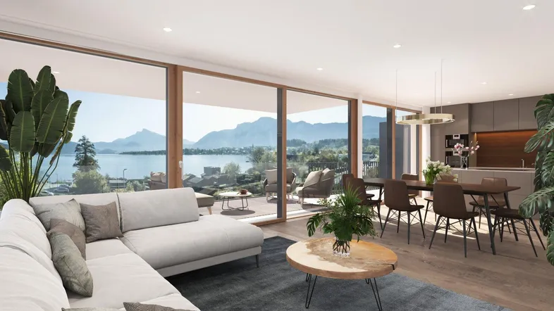 Heller offener Wohn-Essbereich mit moderner Küche, Seeblick und Zugang zur Terrasse.